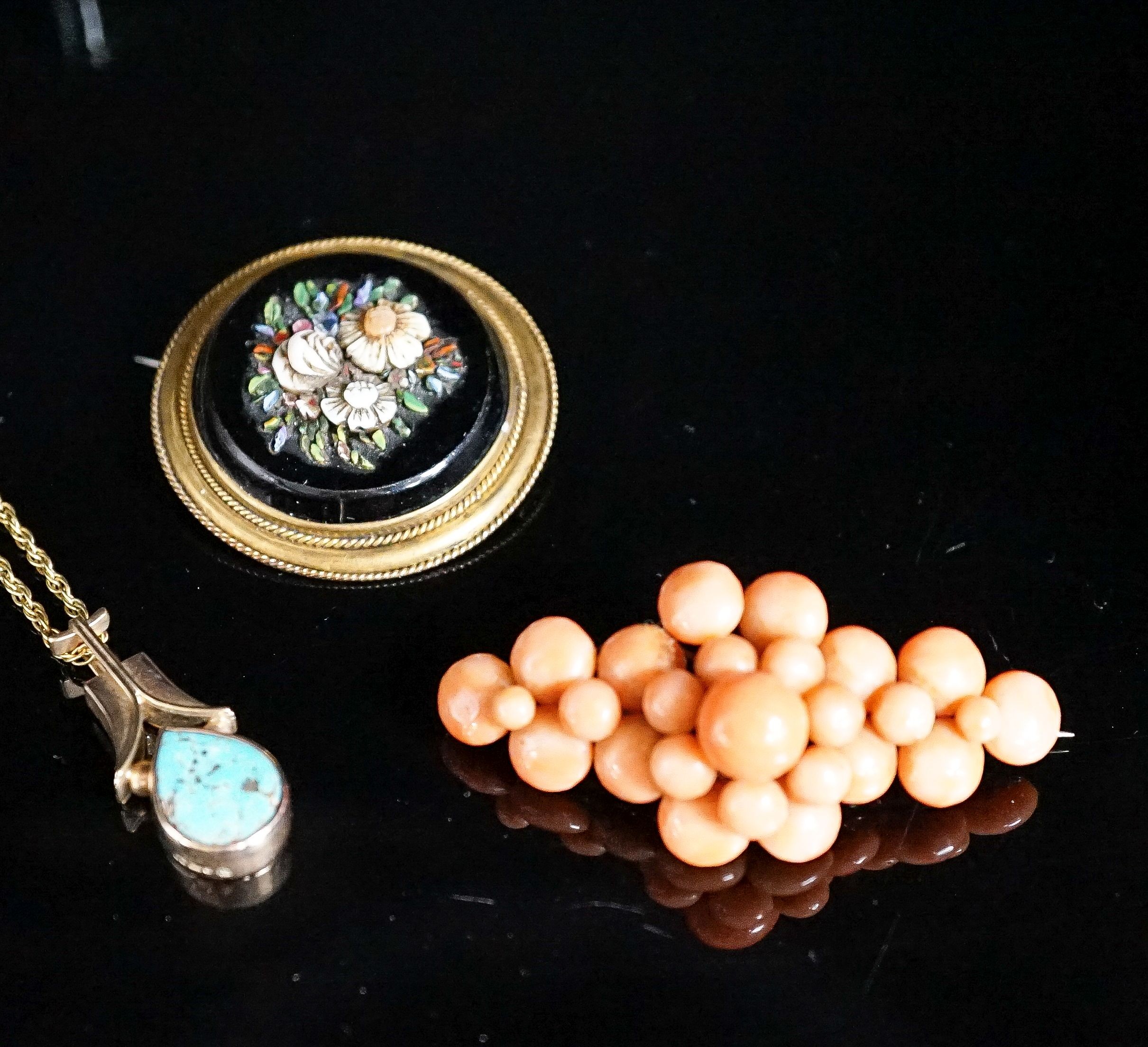 A Victorian yellow metal, black onyx and hardstone set circular brooch, 38mm, a yellow metal and coral bead brooch and a yellow metal and turquoise set pendant, on a 375 chain.